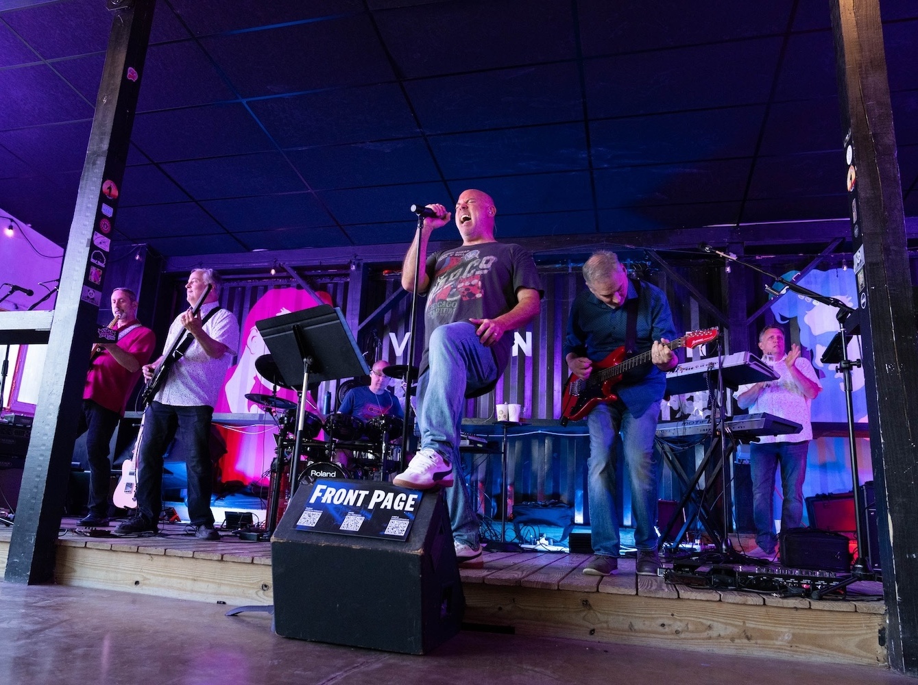 band rocking out on stage